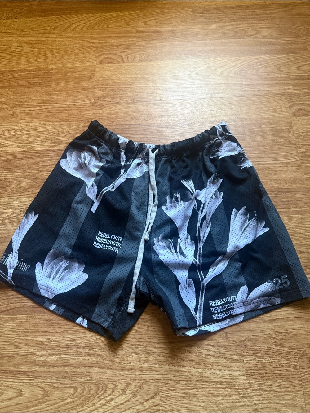 Civil Regime floral mesh shorts
